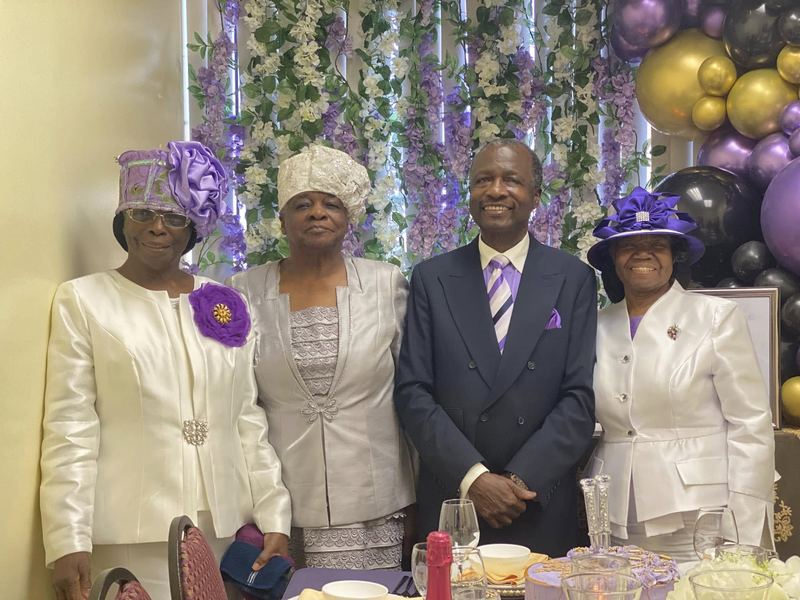 Bishop and Evangelist Wallace with family at a celebration